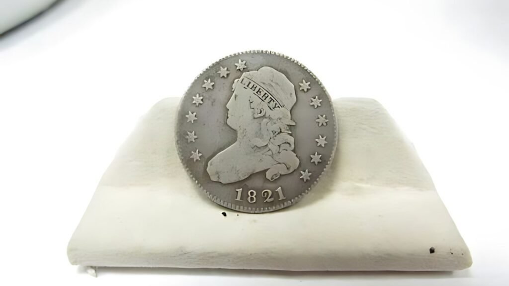 What was the sale record for this 1821 quarter-dollar coin at an auction?